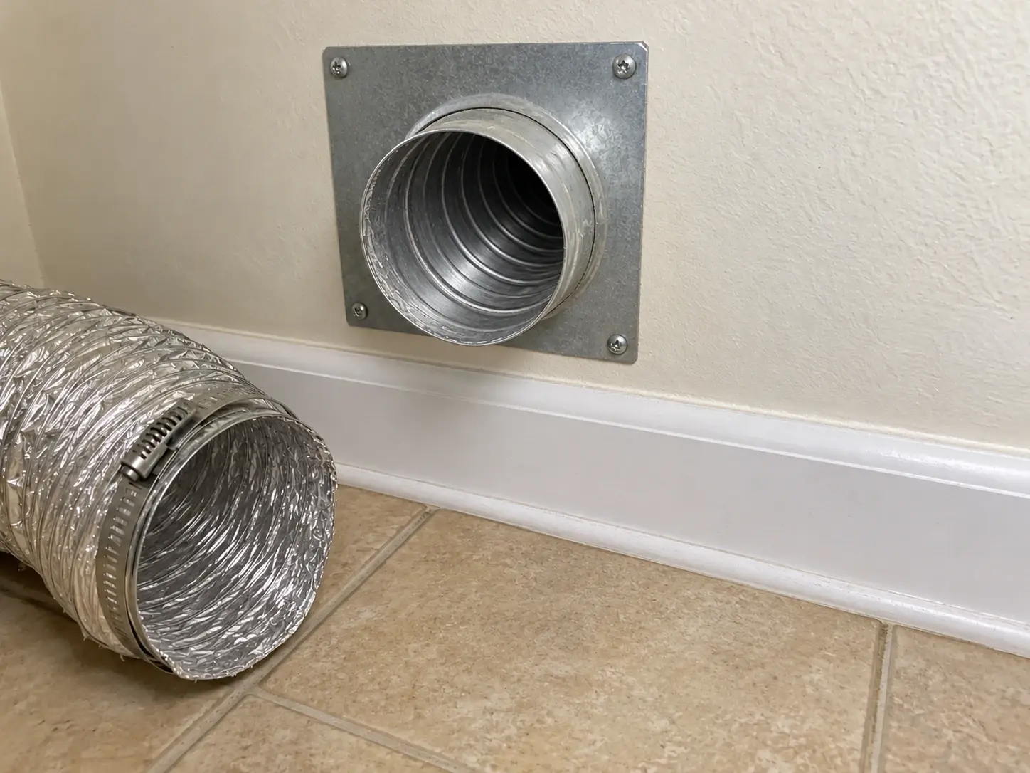 The same dryer vent after cleaning, clear and lint free